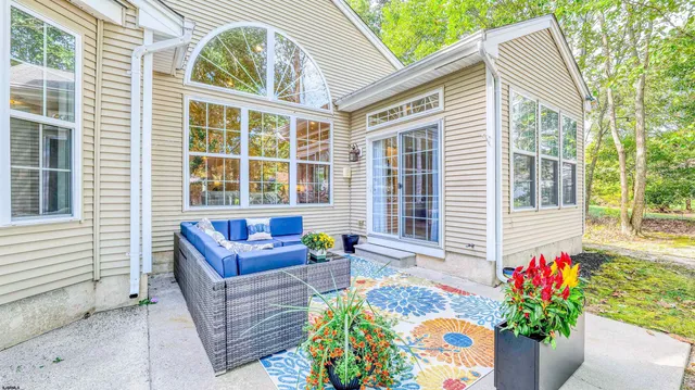 a front view of a house with a garden and porch