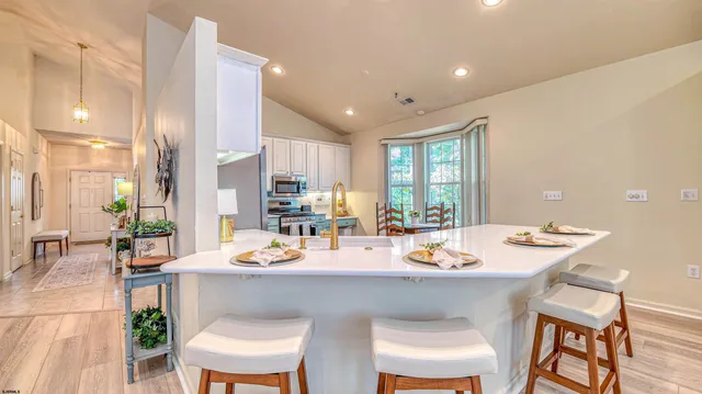 a kitchen with a table and chairs in it