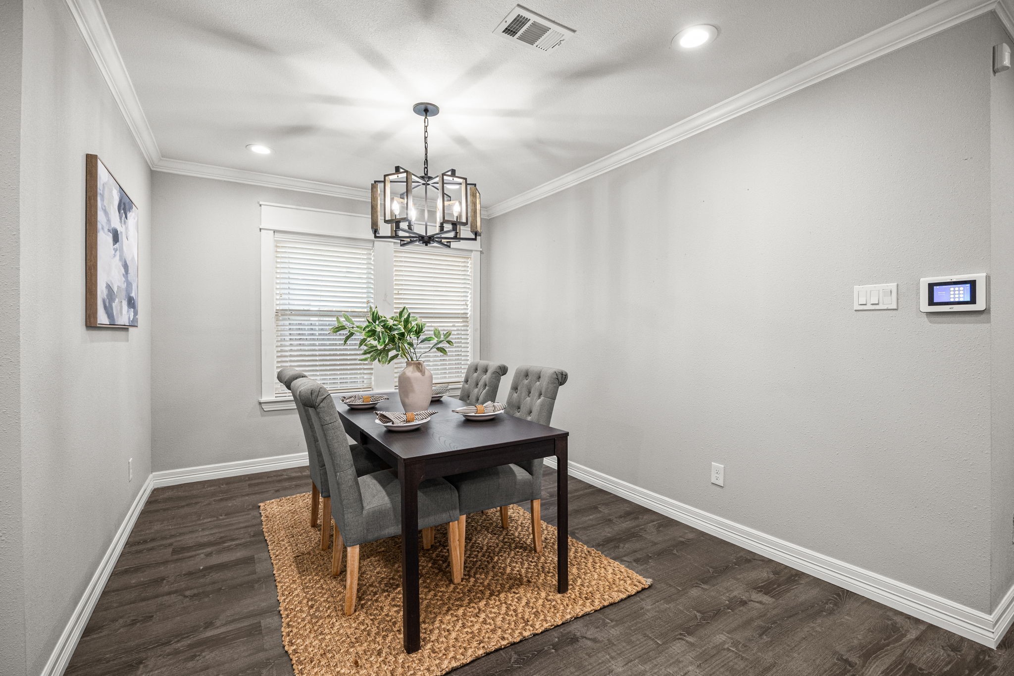 1405 Walton Street Houston, TX 77009 - Photo 11 of 28 Light-filled dining area with large windows and neutral tones, perfect for intimate dinners or entertaining guests.