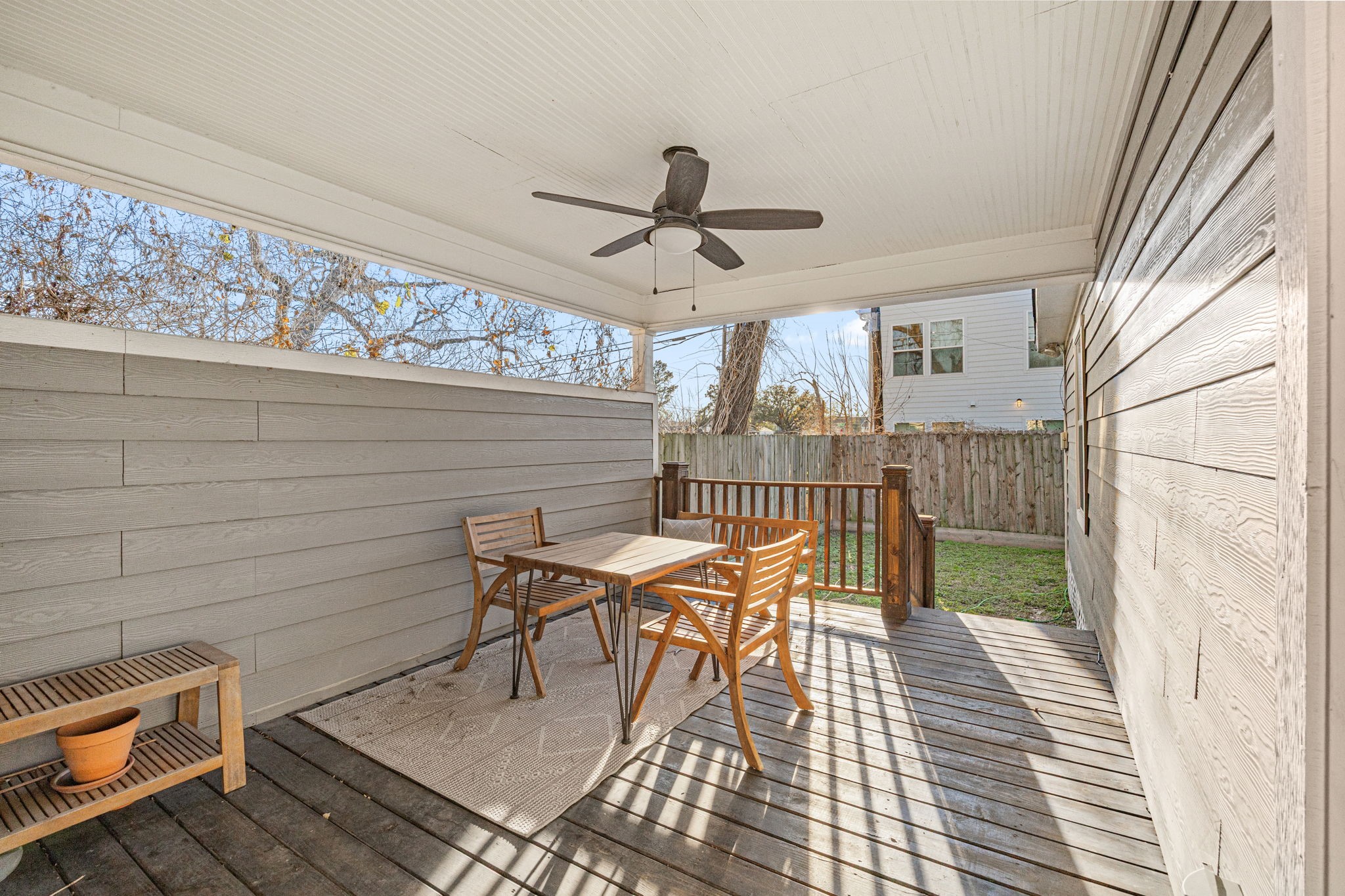 1405 Walton Street Houston, TX 77009 - Photo 25 of 28 Spacious covered side deck with ceiling fan, the perfect spot for morning coffee, outdoor dining, or relaxing evenings year-round.