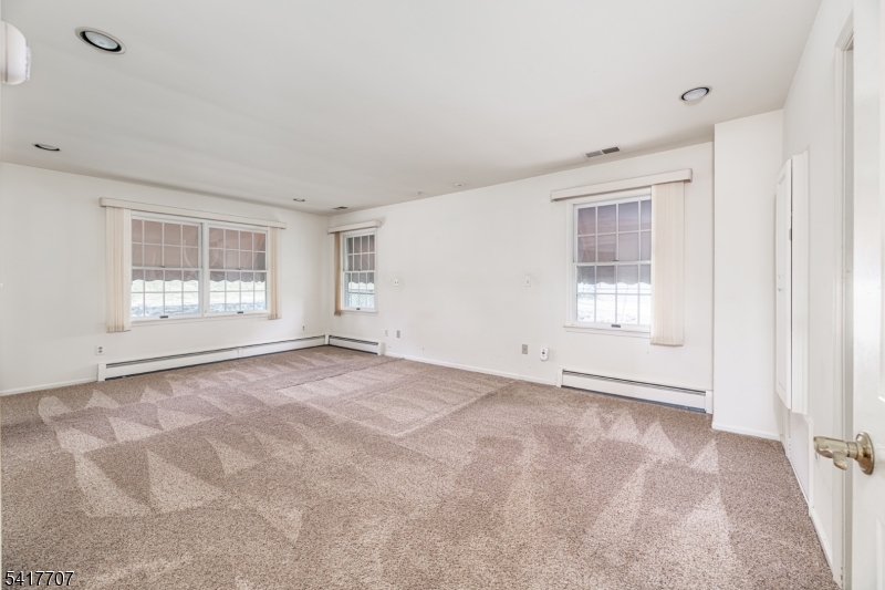 23 Old Denville Road Boonton, NJ 07005 - Photo 12 of 50 a view of an empty room with a window
