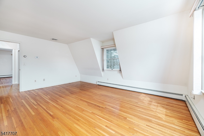 23 Old Denville Road Boonton, NJ 07005 - Photo 16 of 50 a view of empty room with wooden floor