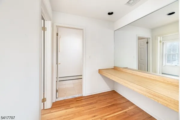 a view of a room with wooden walls