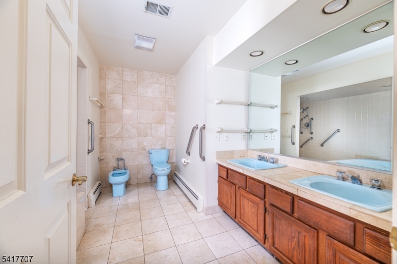 23 Old Denville Road Boonton, NJ 07005 - Photo 23 of 50 a spacious bathroom with a granite countertop sink mirror and a toilet