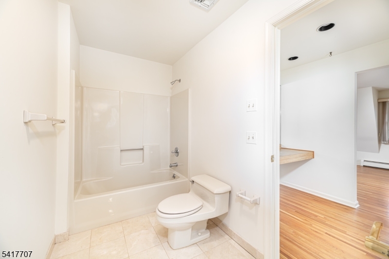 23 Old Denville Road Boonton, NJ 07005 - Photo 25 of 50 a bathroom with a toilet a sink and shower