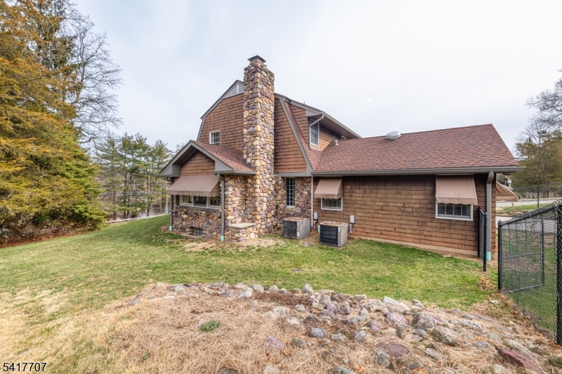23 Old Denville Road Boonton, NJ 07005 - Photo 40 of 50 a front view of a house with a yard and garage