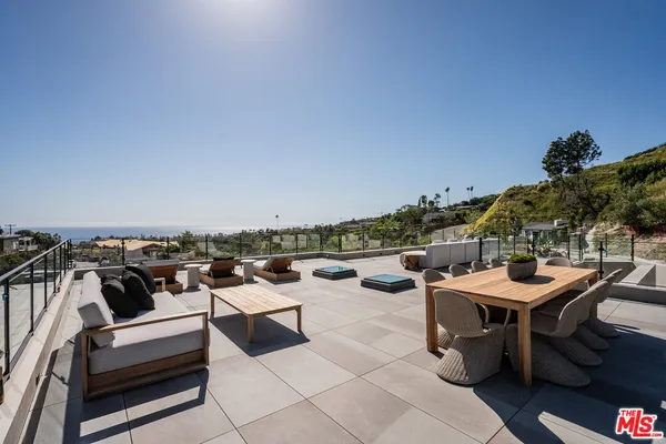 a view of a terrace with sitting area