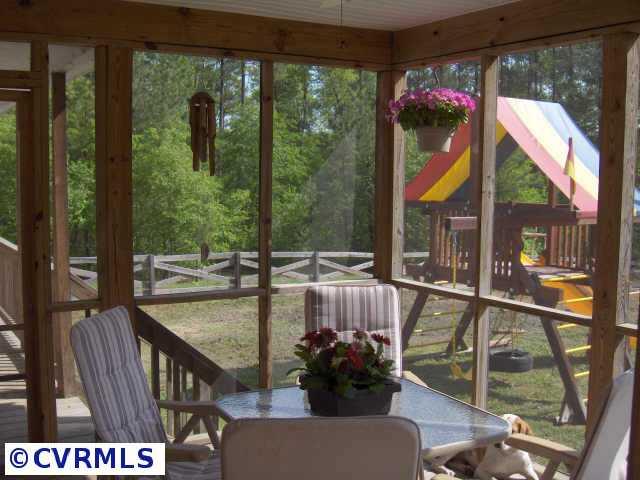 17419 Fox Branch Road Carson, VA 23830 - Photo 3 of 10 a view of a porch with furniture and wooden porch