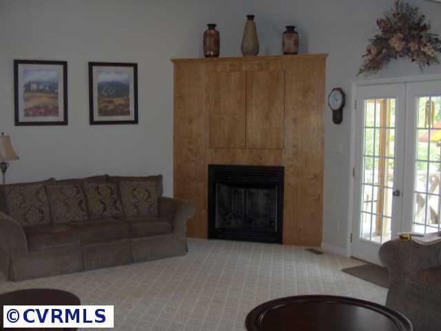 17419 Fox Branch Road Carson, VA 23830 - Photo 6 of 10 a living room with furniture and a fireplace