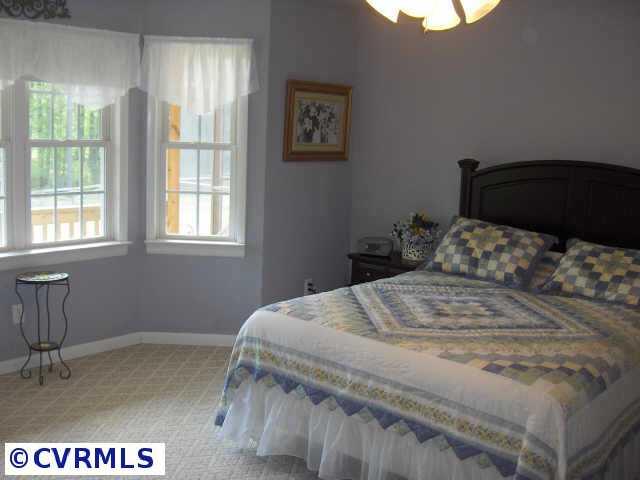 17419 Fox Branch Road Carson, VA 23830 - Photo 8 of 10 a bedroom with a bed and a window