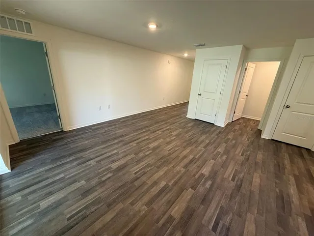 a view of a livingroom with wooden floor