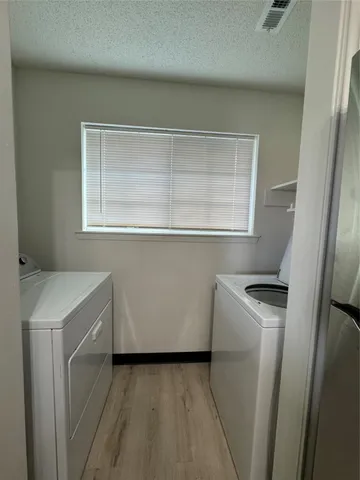 a utility room with a sink a washer and dryer