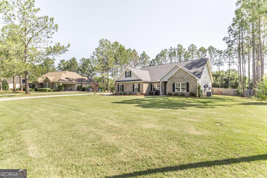 609 Live Oak Way Dublin, GA 31021 - Photo 4 of 37 a view of a house with a swimming pool