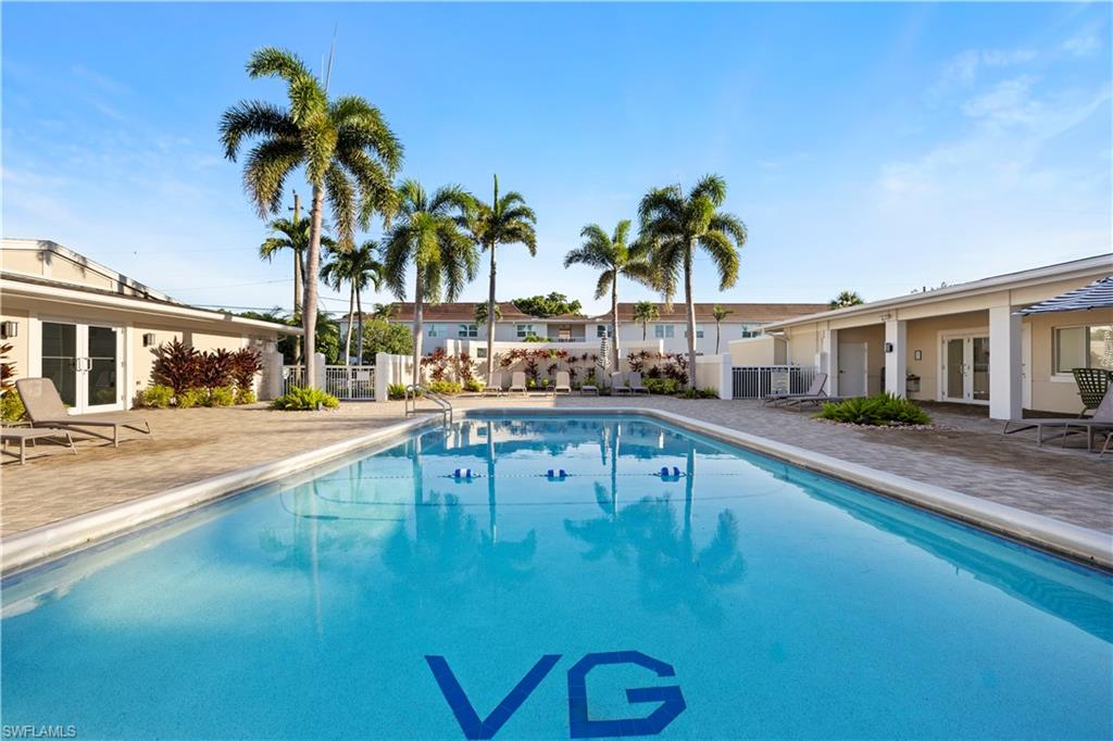 578 Broad Avenue South, Unit 578 Naples, FL 34102 - Photo 28 of 32 a view of a swimming pool with a patio