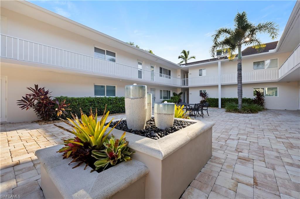 578 Broad Avenue South, Unit 578 Naples, FL 34102 - Photo 4 of 32 a front view of a house with patio