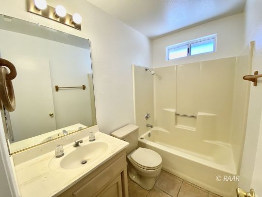 401 South Fountain Street Ridgecrest, CA 93555 - Photo 16 of 29 a bathroom with a sink a toilet and shower
