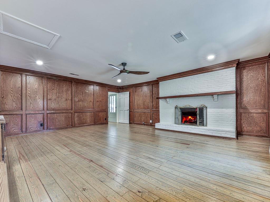 633 Butterworth Road Canton, GA 30114 - Photo 15 of 55 a view of an empty room with wooden floor and a fireplace