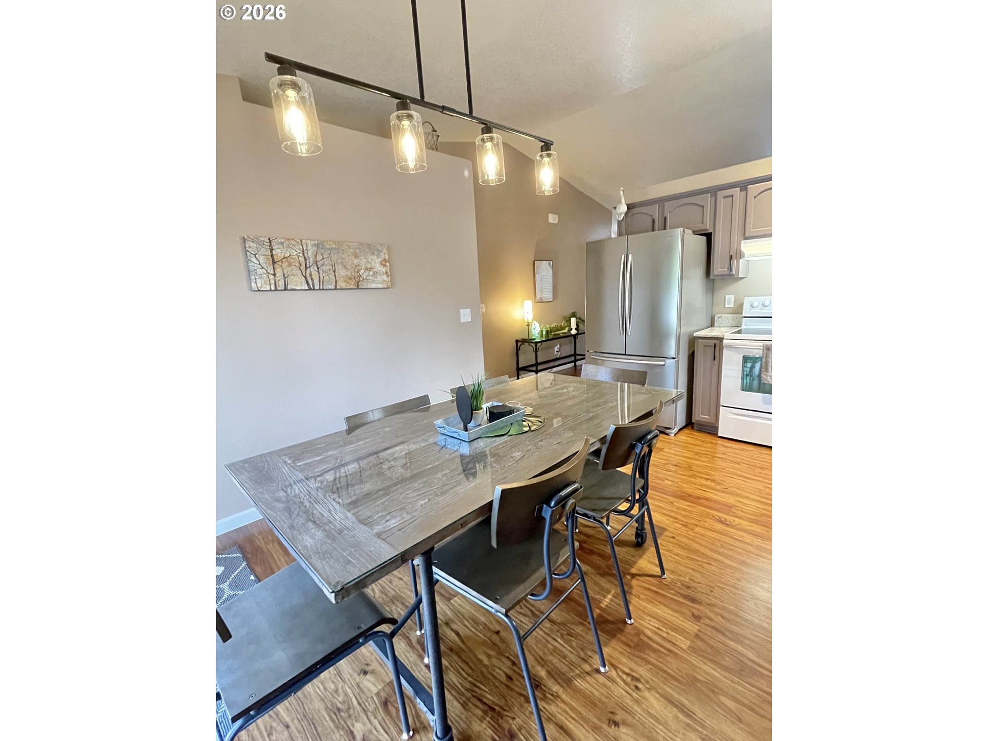 135 Wander Way Southeast Salem, OR 97301 - Photo 14 of 36 a view of a dining room with furniture and a chandelier