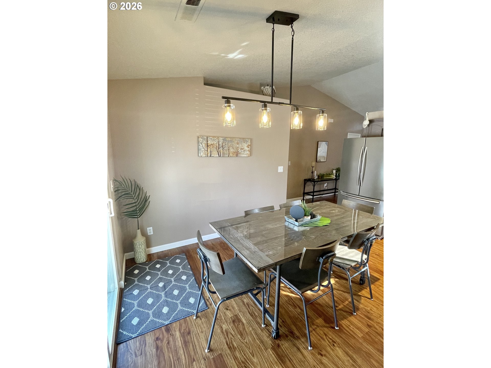 135 Wander Way Southeast Salem, OR 97301 - Photo 15 of 36 a view of a room with a table and chairs