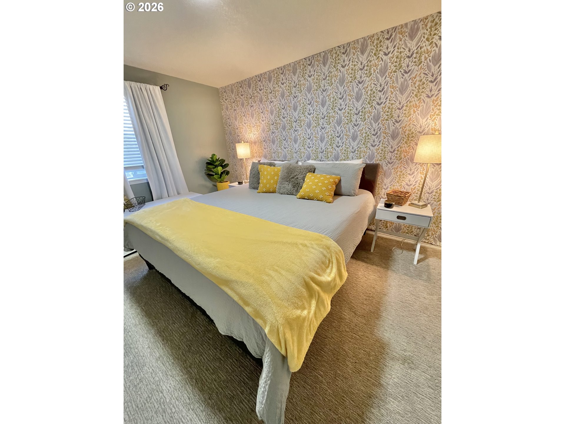 135 Wander Way Southeast Salem, OR 97301 - Photo 21 of 36 a bed sitting in a bedroom next to a window with wooden floor