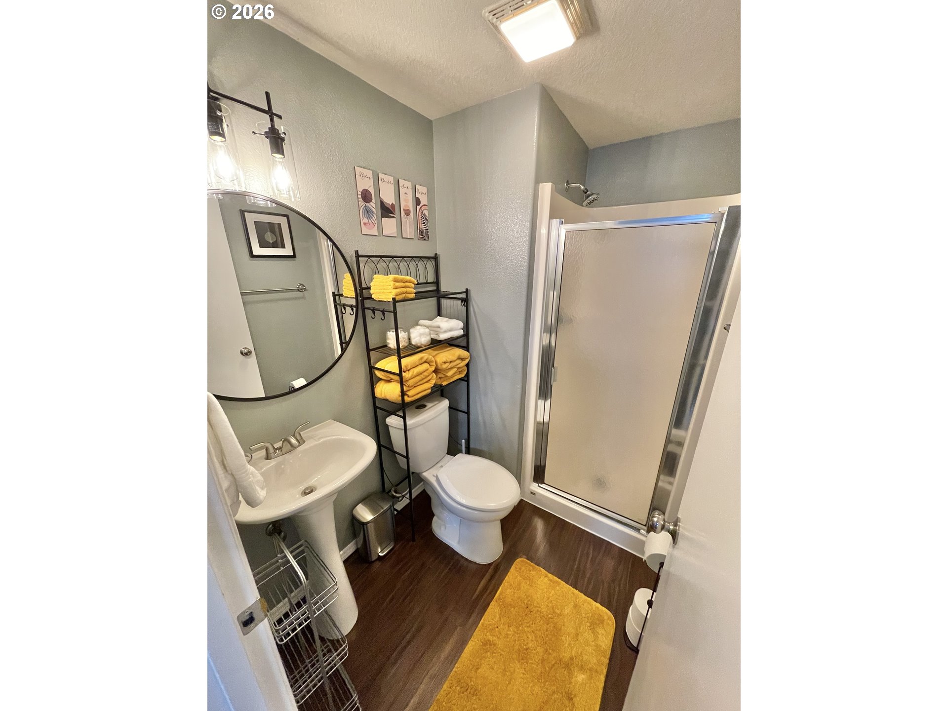 135 Wander Way Southeast Salem, OR 97301 - Photo 23 of 36 a white toilet sitting next to a bathroom sink