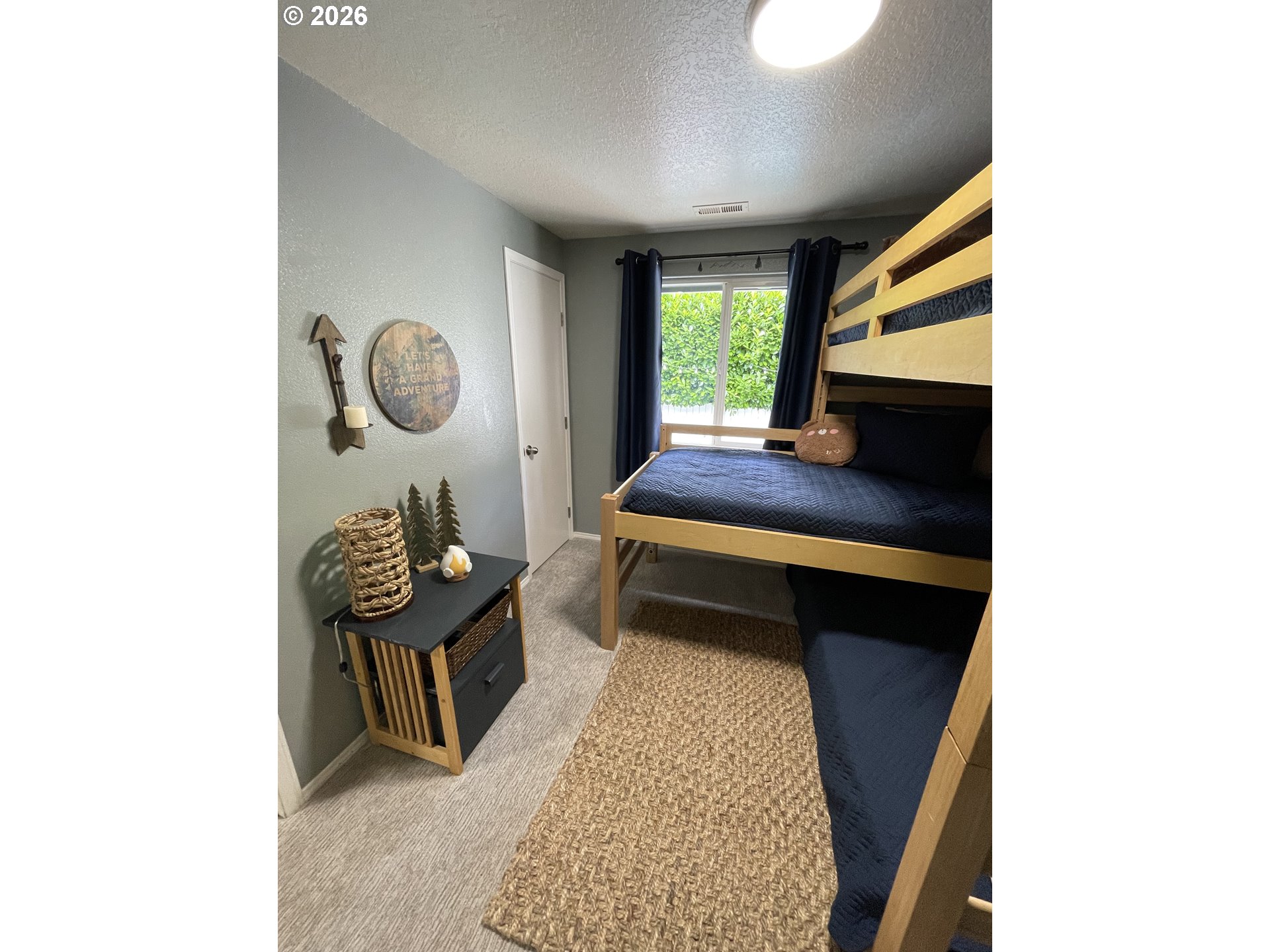 135 Wander Way Southeast Salem, OR 97301 - Photo 28 of 36 a bedroom with a bed and a window