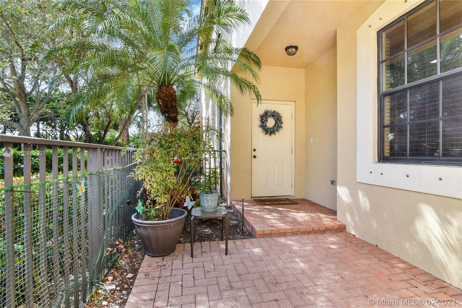 4100 Forest Drive, Unit 4100 Weston, FL 33332 - Photo 2 of 14 a view of a backyard of the house with potted plants