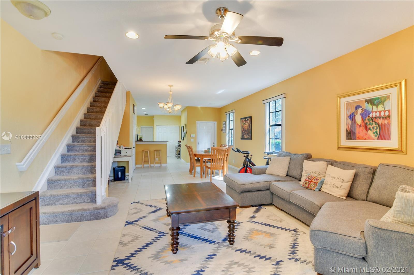 4100 Forest Drive, Unit 4100 Weston, FL 33332 - Photo 14 of 14 a living room with furniture ceiling fan and a rug