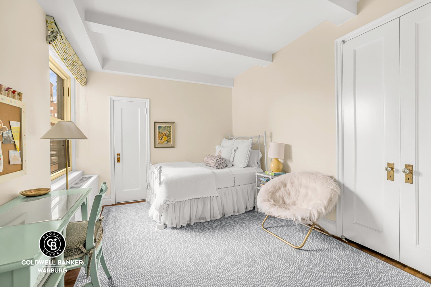 215 East 72nd Street, Unit 12E Manhattan, NY 10021 - Photo 8 of 13 a bedroom with bed and window