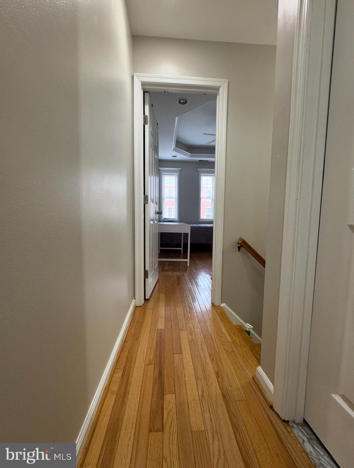 1746 South Hanover Street Baltimore, MD 21230 - Photo 11 of 19 a view of a room with wooden floor a fireplace and a window