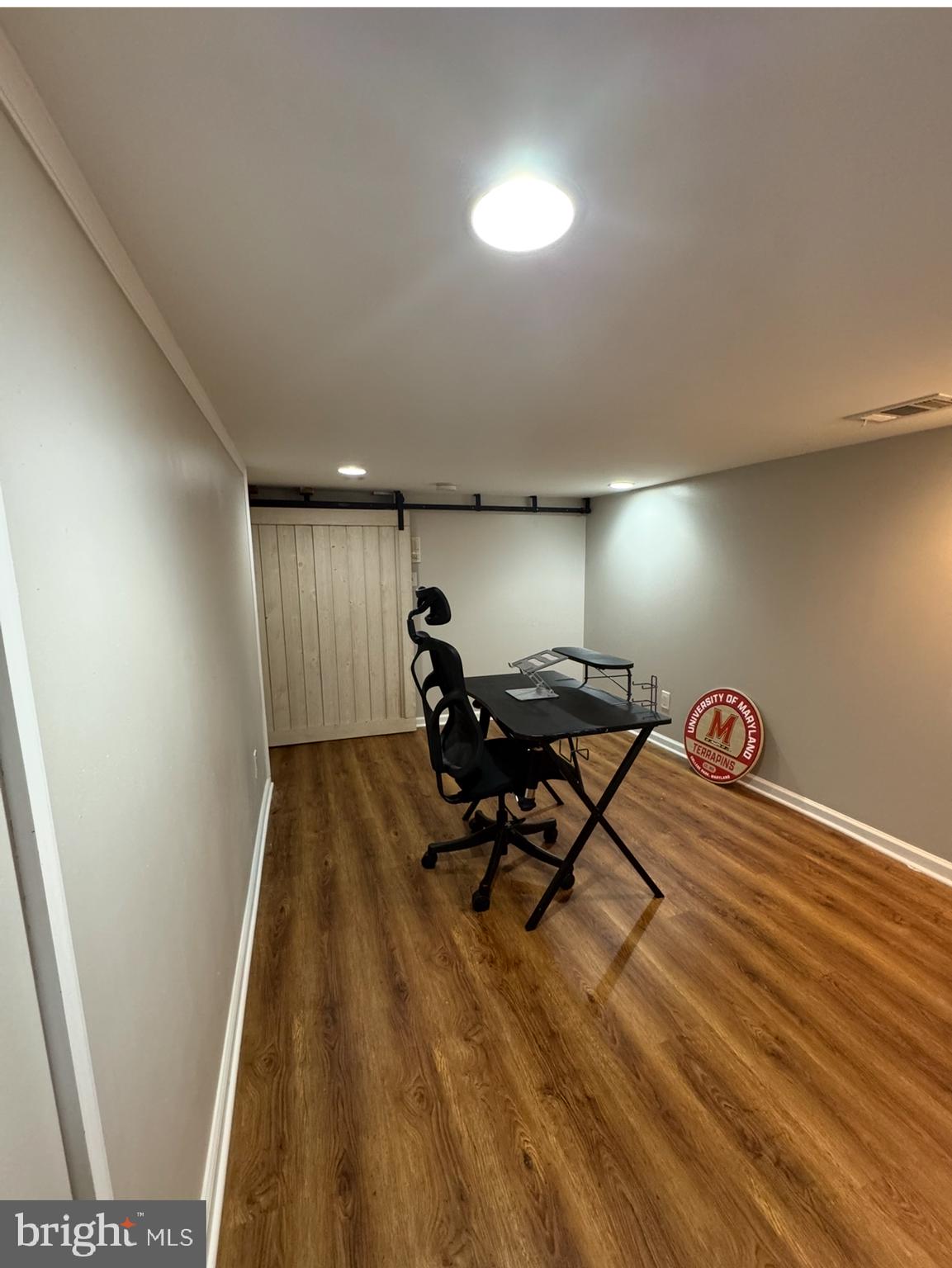 1746 South Hanover Street Baltimore, MD 21230 - Photo 18 of 19 a view of a room with furniture and wooden floor