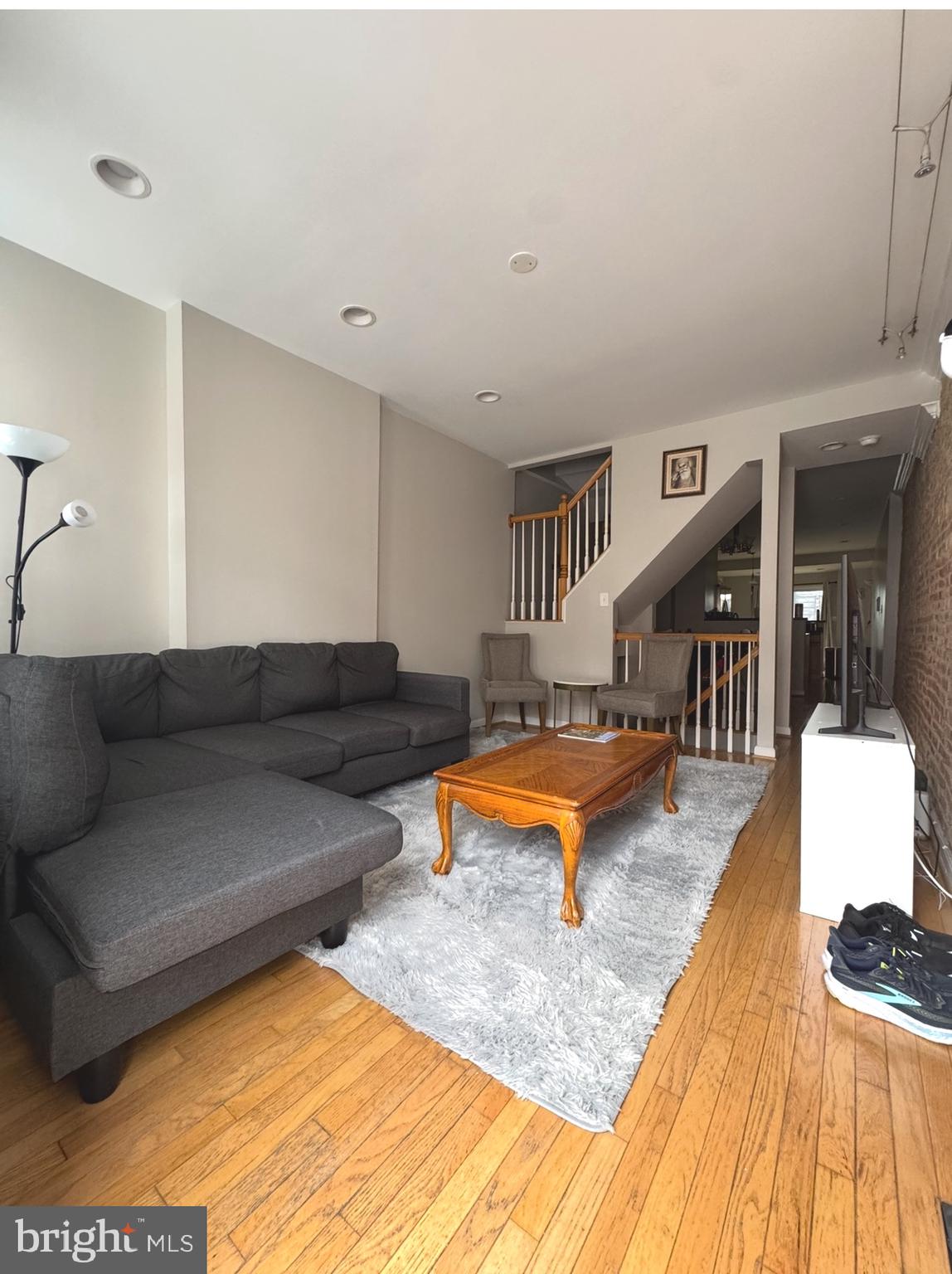 1746 South Hanover Street Baltimore, MD 21230 - Photo 5 of 19 a living room with furniture and a wooden floor