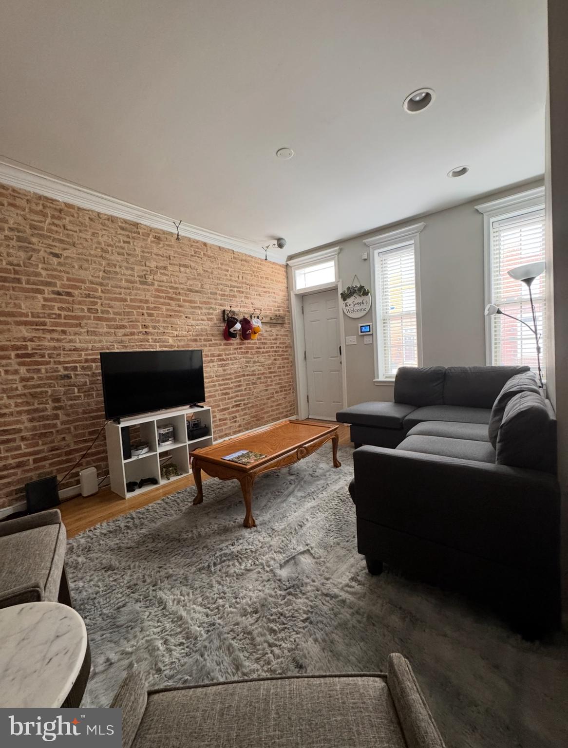 1746 South Hanover Street Baltimore, MD 21230 - Photo 6 of 19 a living room with furniture and a fireplace