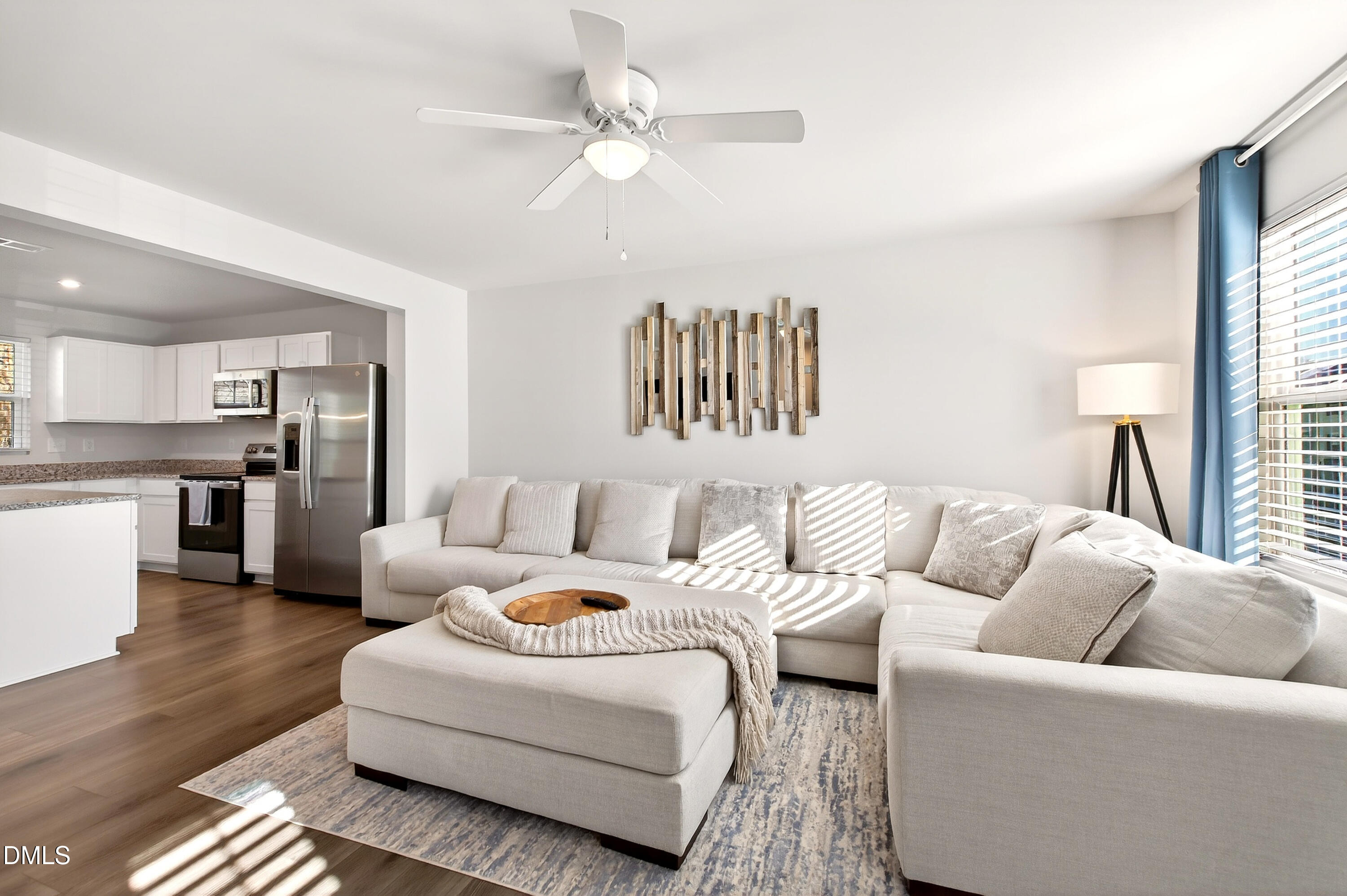 4629 Great Egret Way Raleigh, NC 27616 - Photo 10 of 48 a living room with furniture white walls and a chandelier
