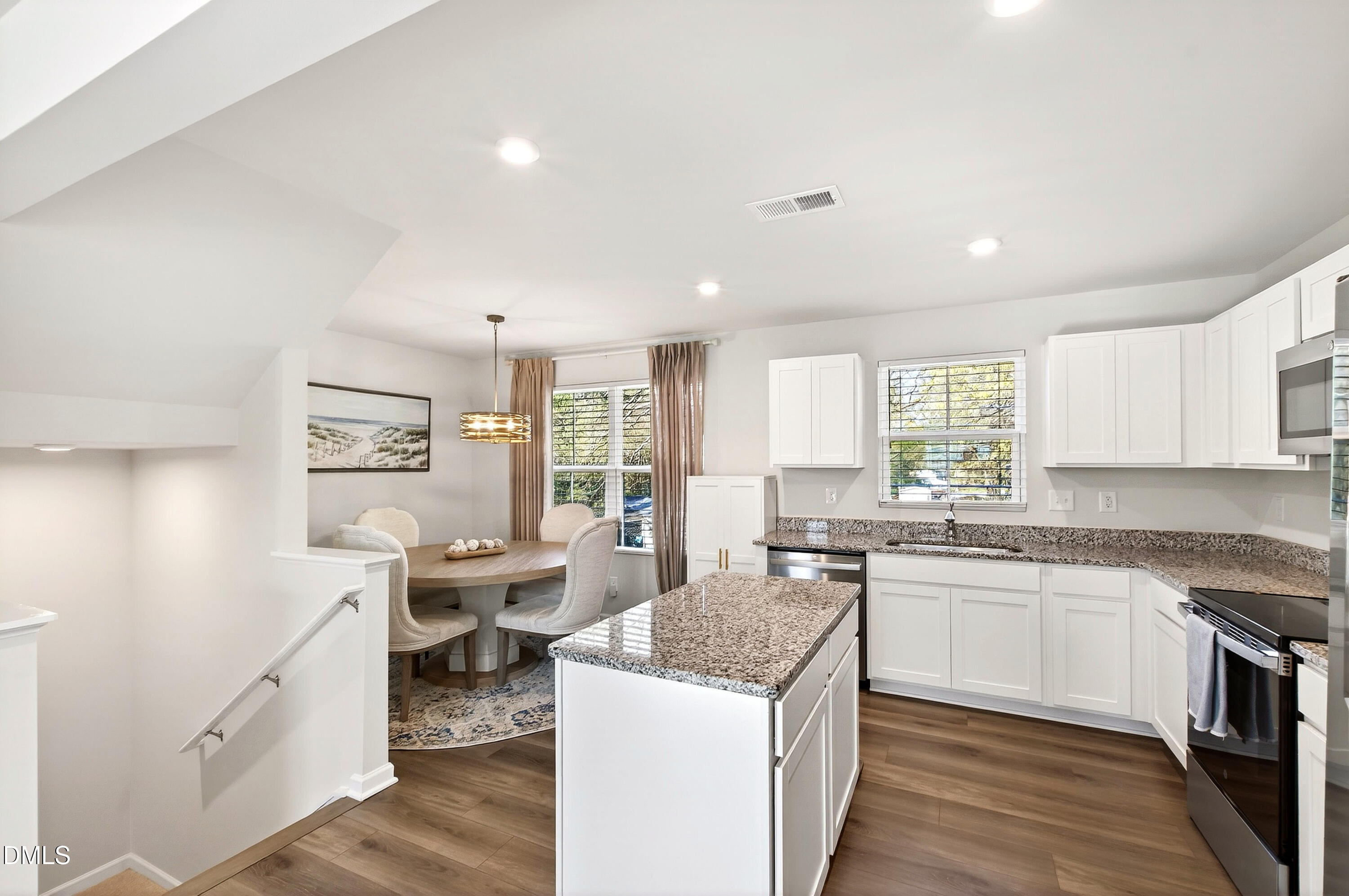 4629 Great Egret Way Raleigh, NC 27616 - Photo 11 of 48 a kitchen with a sink stove and cabinets