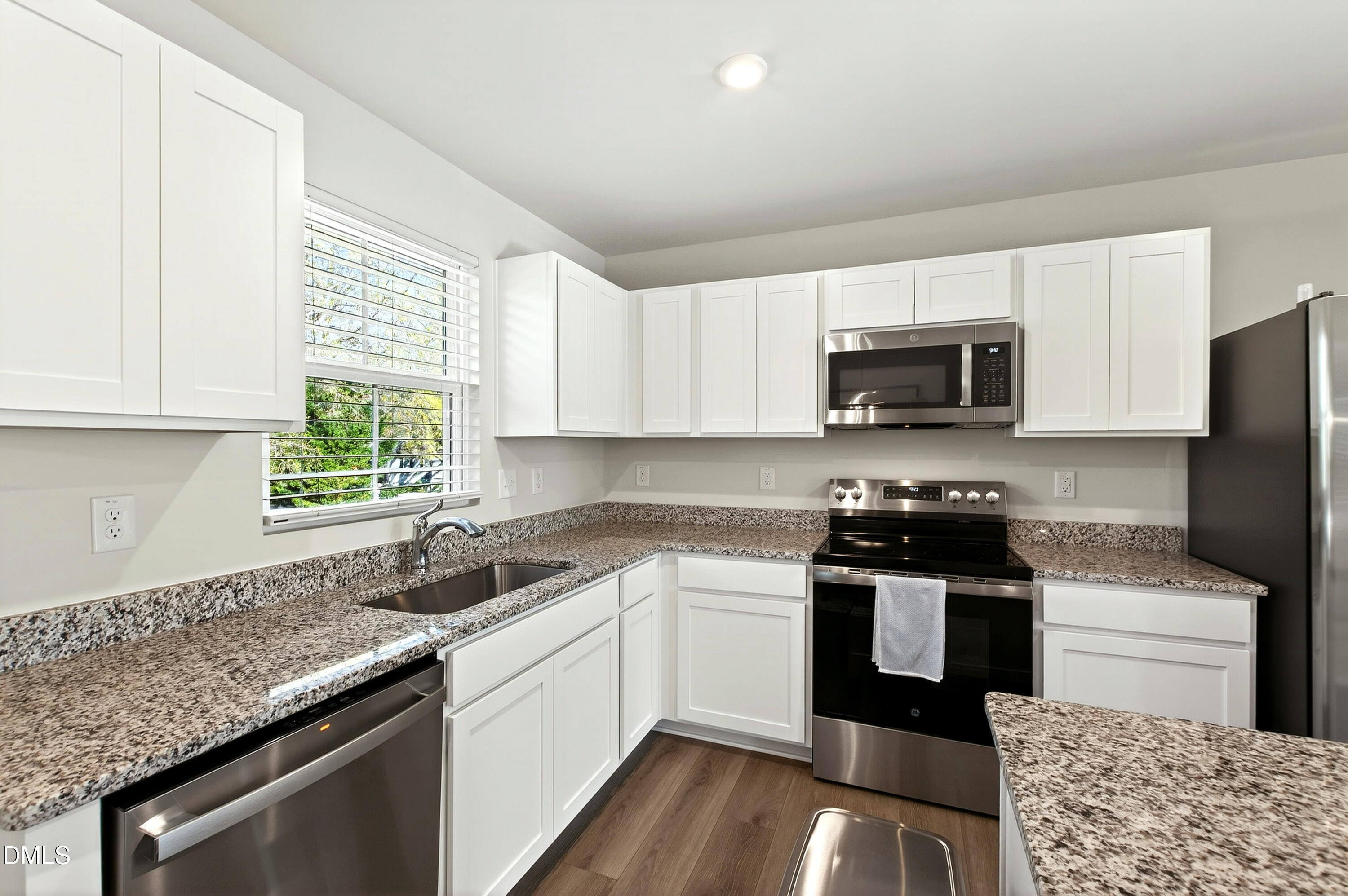 4629 Great Egret Way Raleigh, NC 27616 - Photo 12 of 48 a kitchen with a sink stove top oven and microwave