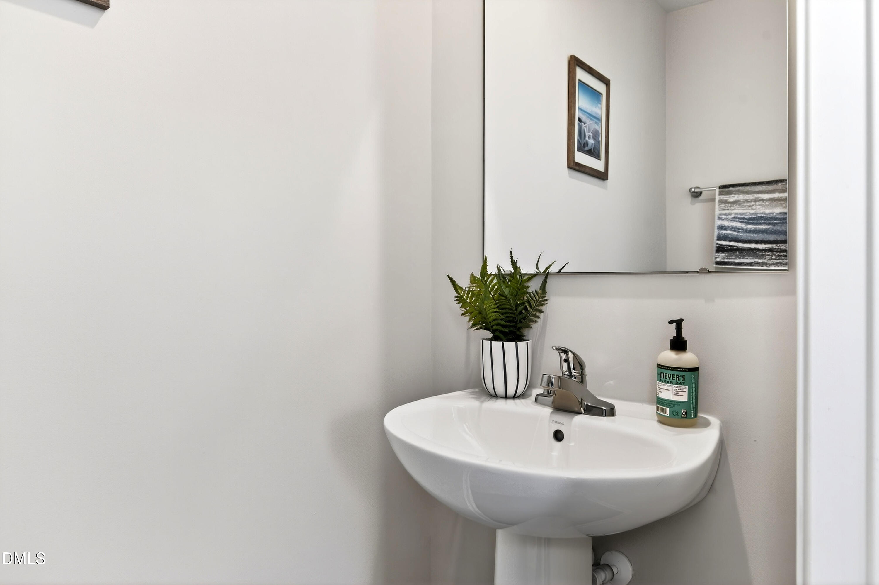 4629 Great Egret Way Raleigh, NC 27616 - Photo 17 of 48 a bathroom with a sink and a mirror