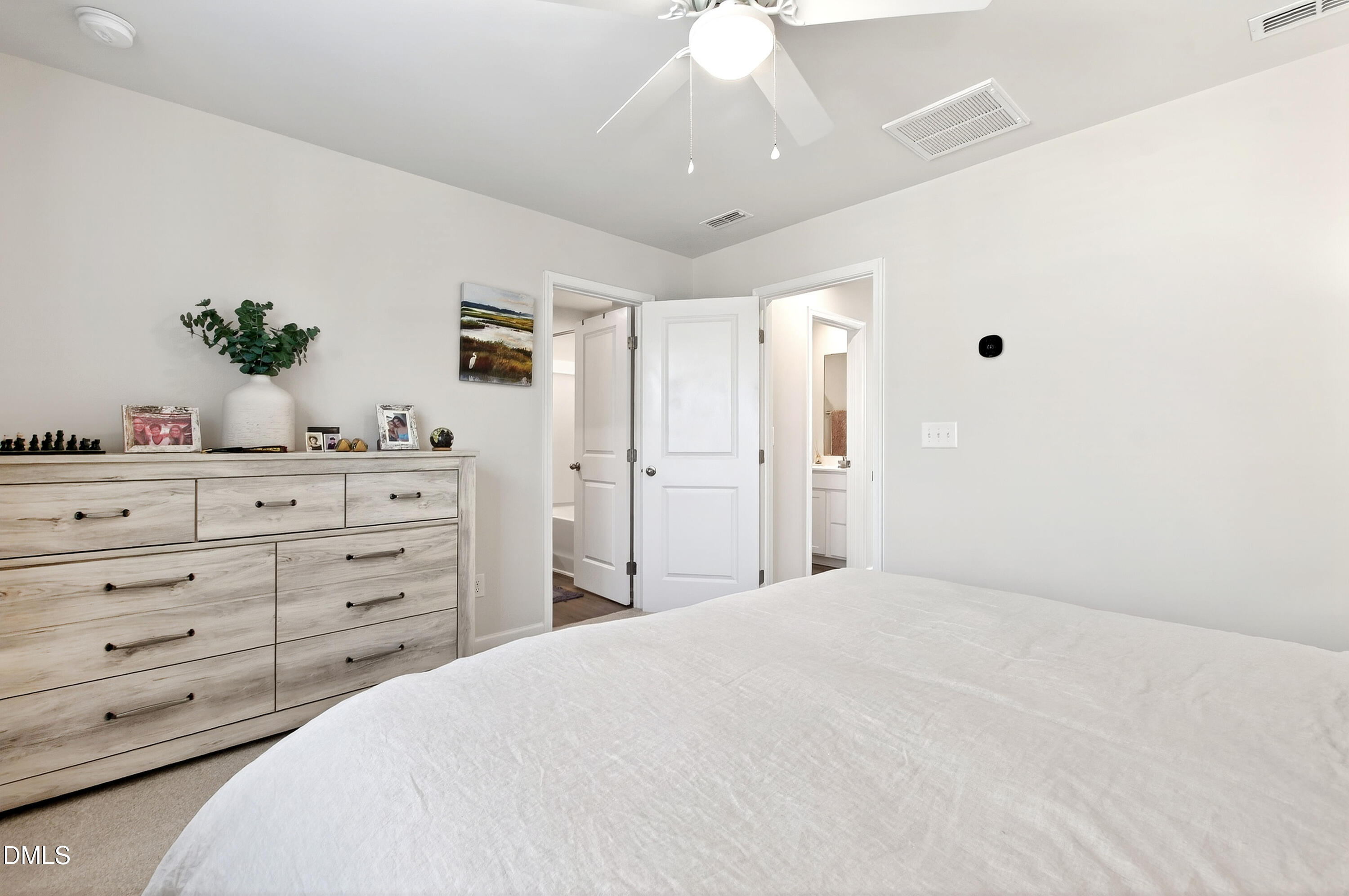 4629 Great Egret Way Raleigh, NC 27616 - Photo 19 of 48 a bedroom with a large bed and a dresser