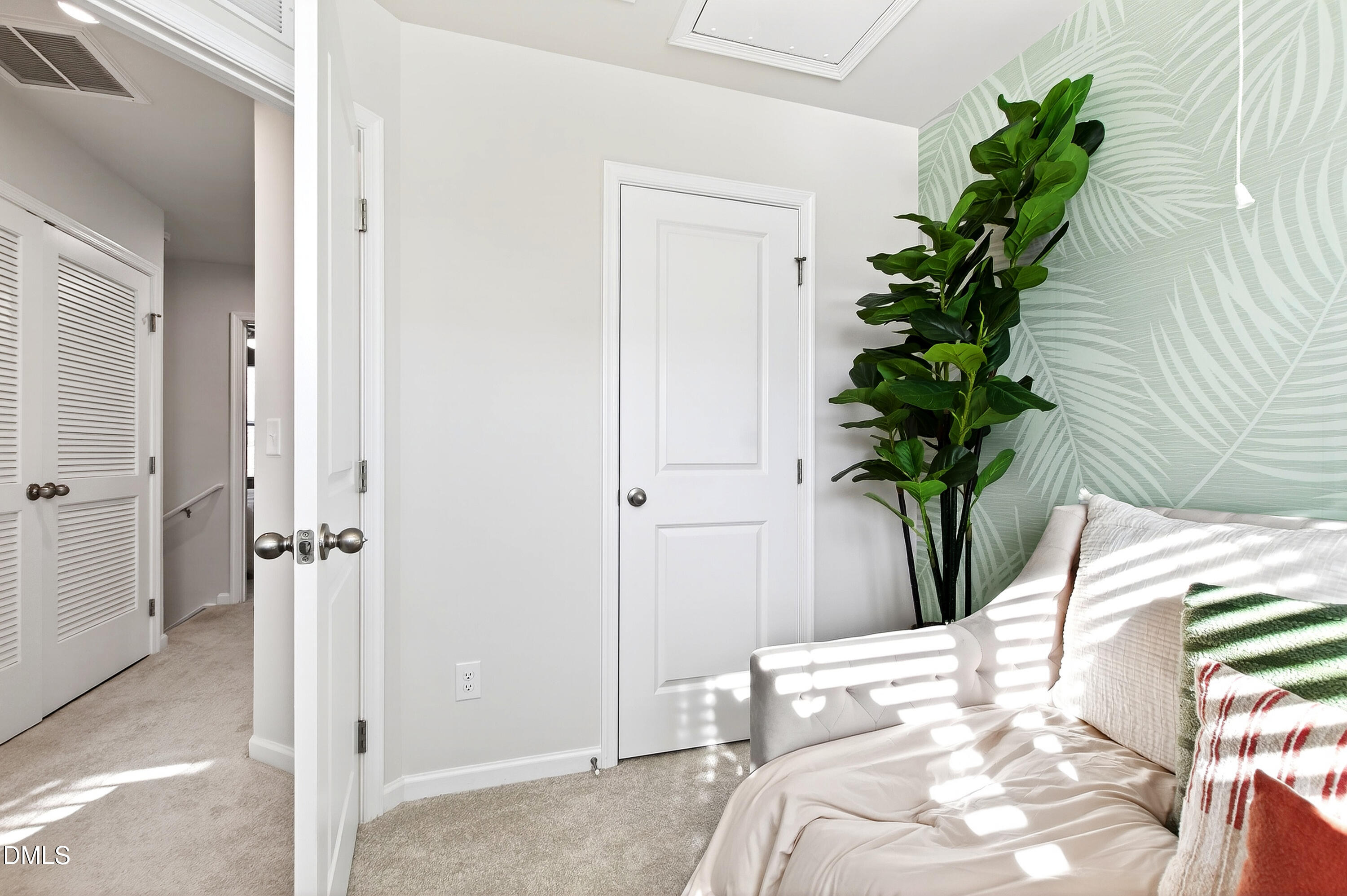 4629 Great Egret Way Raleigh, NC 27616 - Photo 22 of 48 a bedroom with bed and a potted plant