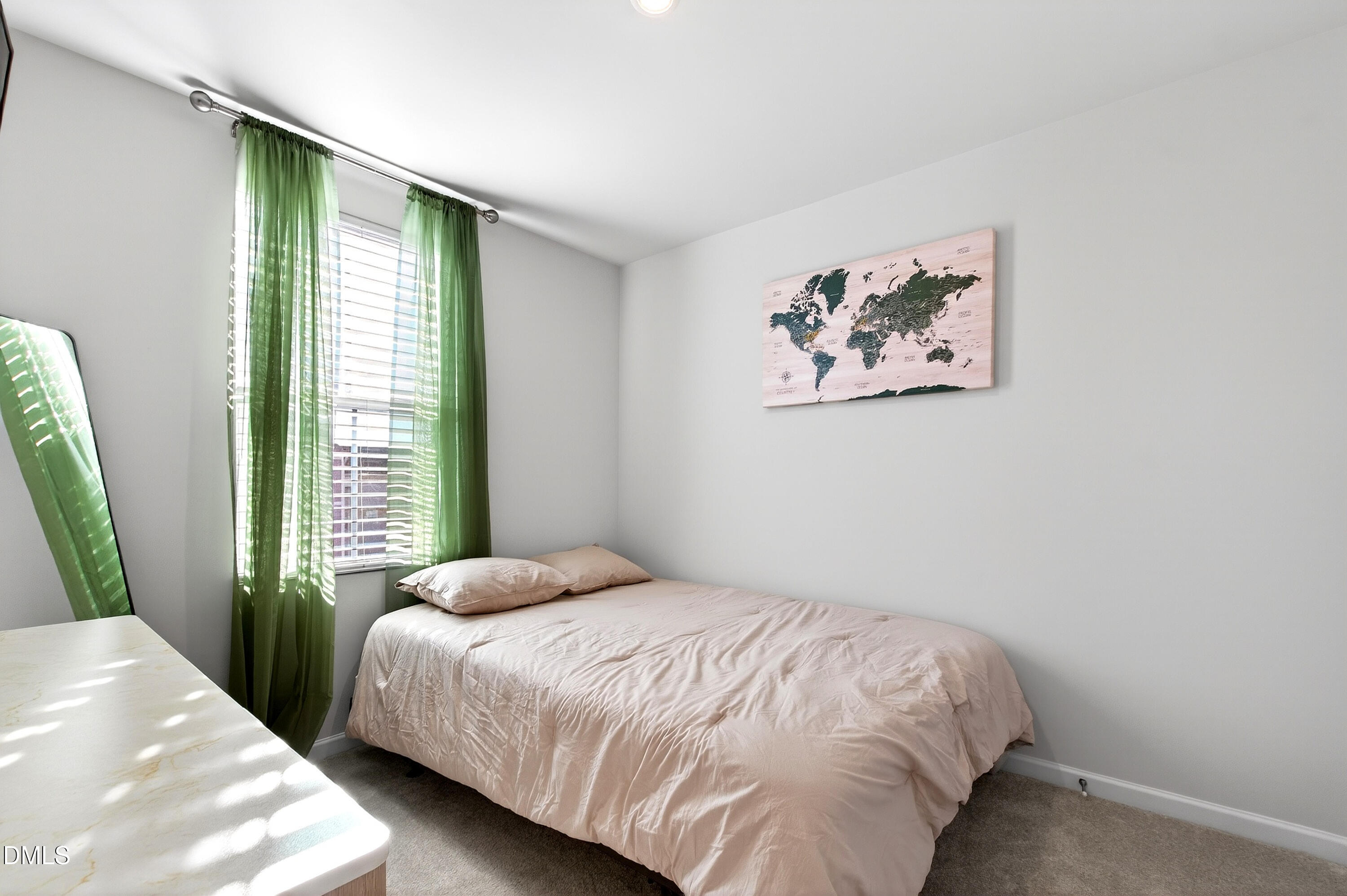 4629 Great Egret Way Raleigh, NC 27616 - Photo 25 of 48 a bedroom with a large bed and a window