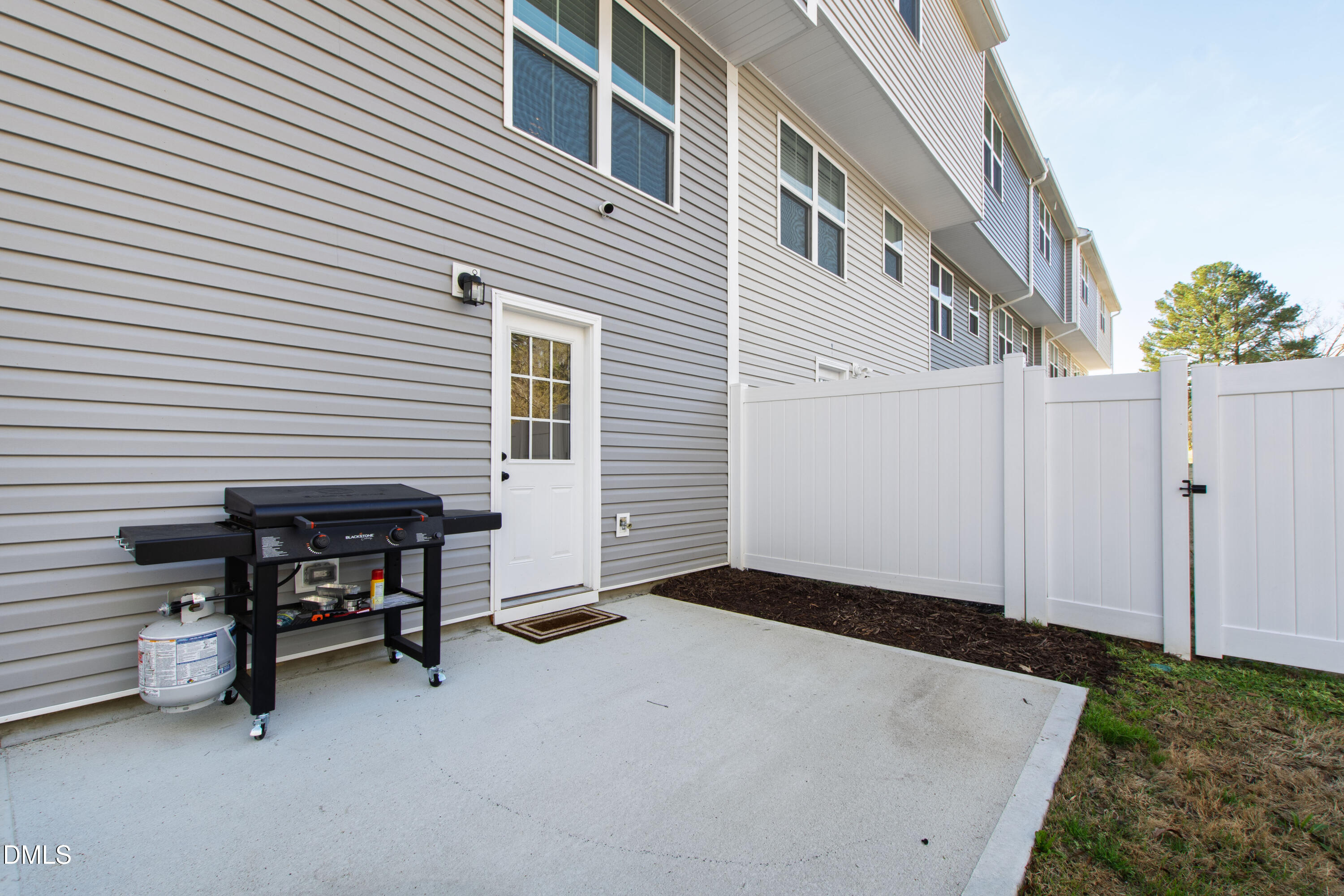 4629 Great Egret Way Raleigh, NC 27616 - Photo 32 of 48 a view of backyard with a table and chair