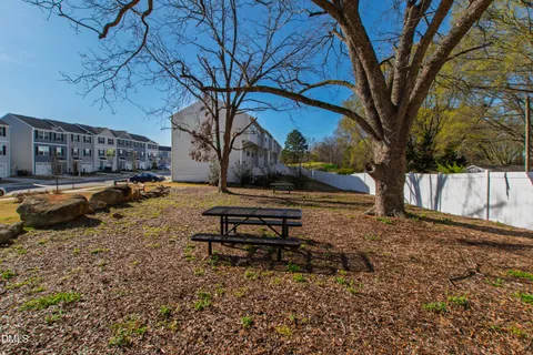 a view of a yard with a tree