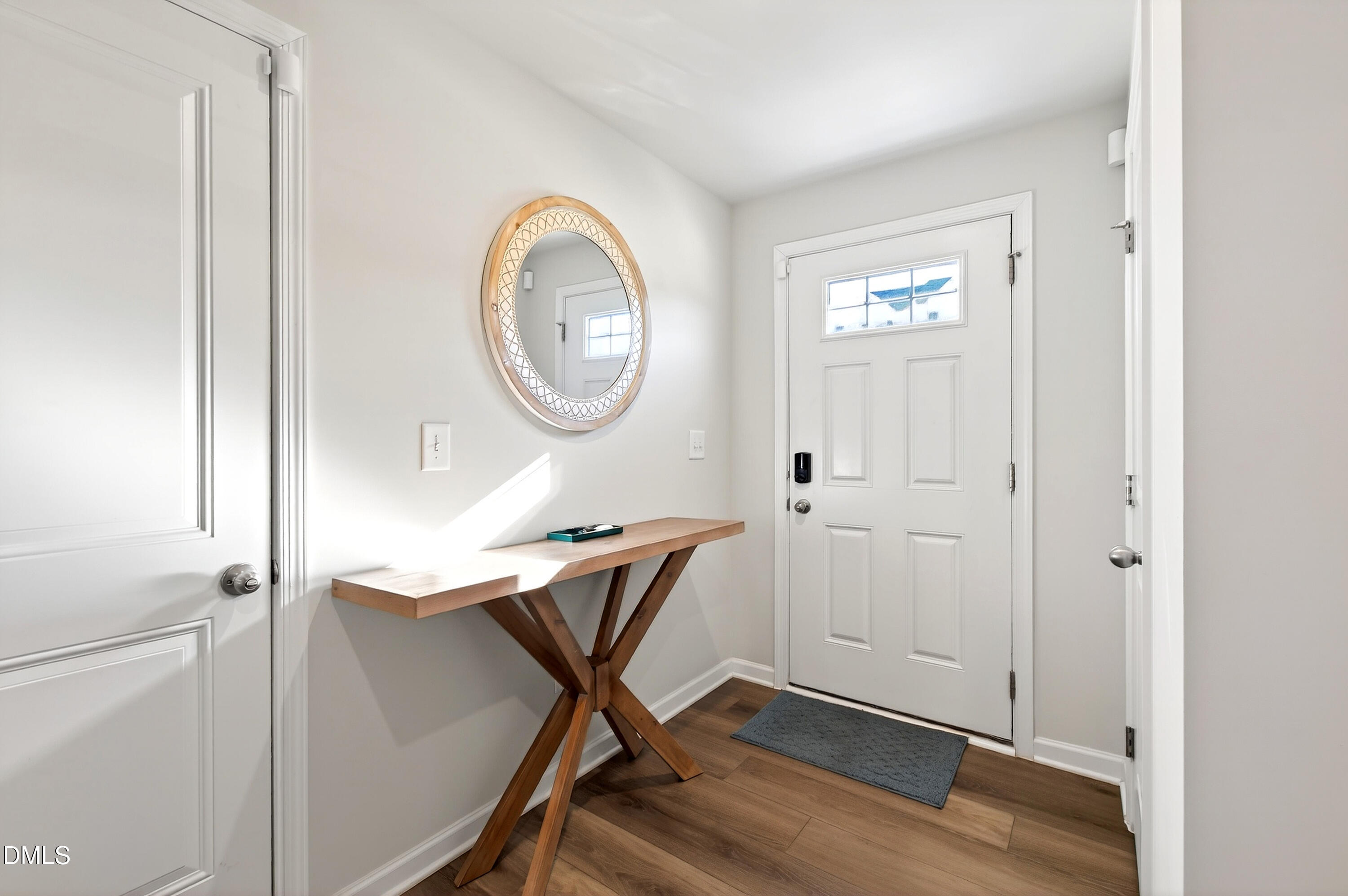 4629 Great Egret Way Raleigh, NC 27616 - Photo 7 of 48 a view of a room with wooden floor mirror and windows