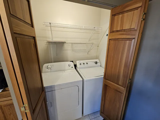 a utility room with dryer and washer