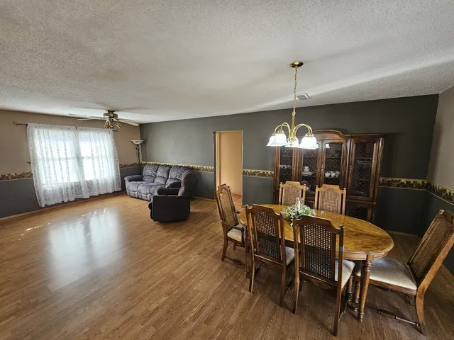 a dining room with furniture and window