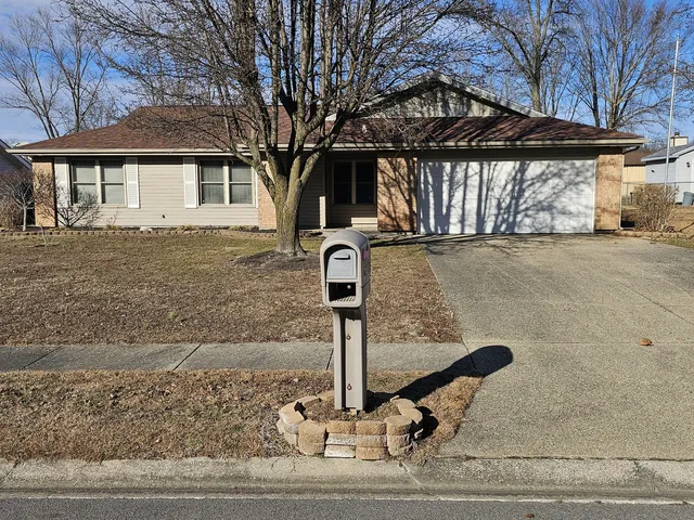a front view of a house with parking yard