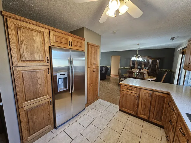 a kitchen with stainless steel appliances a refrigerator and a sink