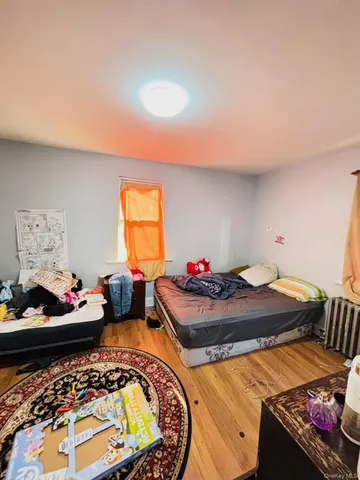 a bedroom with bed and a window