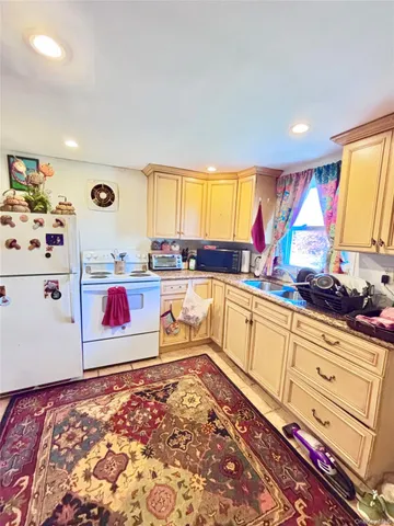 a kitchen with stainless steel appliances granite countertop a sink and cabinets
