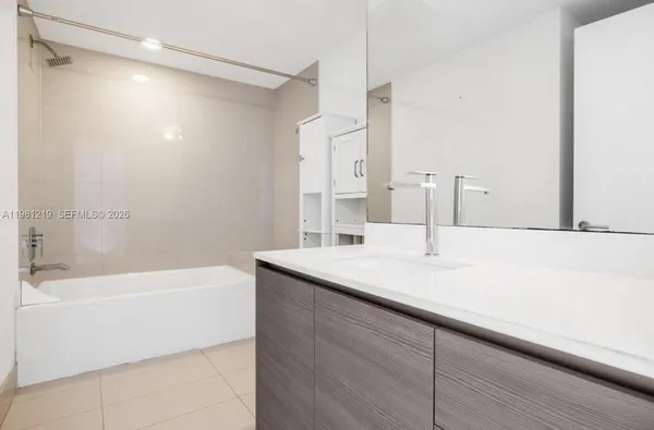 a bathroom with a sink and a bathtub